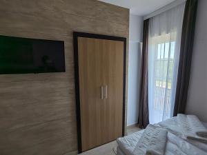 Postel nebo postele na pokoji v ubytování Kumov konak