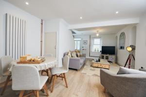 a living room with a table and a couch at Towy Snug in Llandeilo