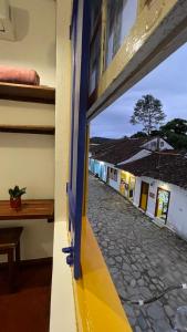 a view of a street from a window of a building at Pousada Aquarium Centro Histórico in Paraty