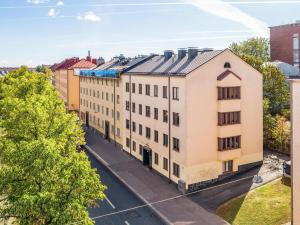 an overhead view of a building on a street at Cozy apartment in Vallila - Helsinki in Helsinki