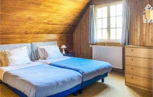 a bedroom with two beds and a wooden ceiling at Awesome Home In Trévou Treguignec in Trélévern +23 photos