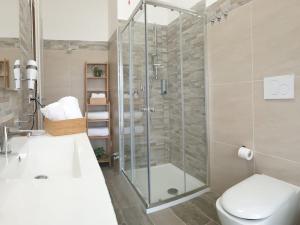 a bathroom with a shower and a toilet and a sink at B&B Dei Cardinali in Terni