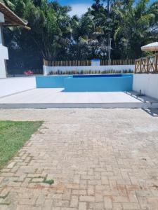 a pool in the backyard of a house at Riverside imbassai bloco B003 in Mata de Sao Joao