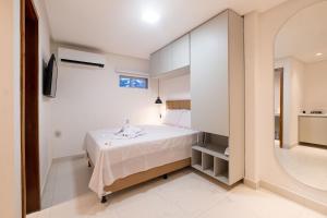 Un pat sau paturi într-o cameră la Pé na Vila