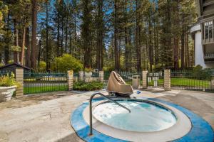 a person sitting on top of a swimming pool at Best Western- Big Bear Chateau in Big Bear Lake