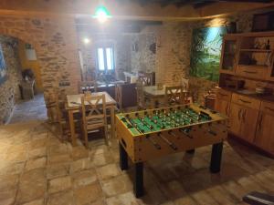 a room with a table and a chess board at Casa Rural La Moraquintana in Santibáñez el Bajo