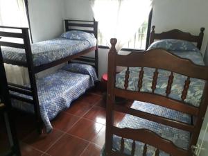Una cama o camas cuchetas en una habitación  de Los Petti casa de campo