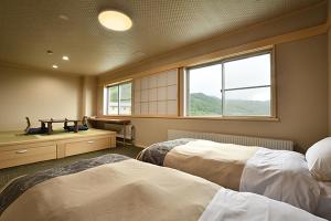 Postel nebo postele na pokoji v ubytování Hotel Takimoto + 37 fotografií