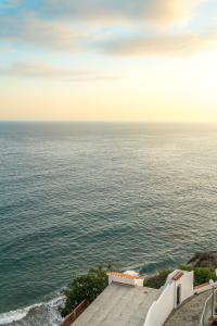 a view of the ocean from a building at Toboso Apar - Turis in Nerja