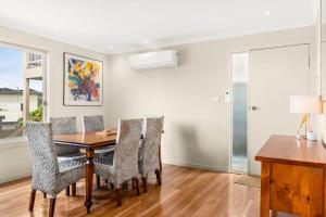 a dining room with a table and chairs at Bayview Unit in Surf Beach