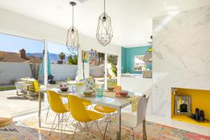 a kitchen and dining room with a table and chairs at Amarillo House - Luxury Home with Pool & Spa in Palm Springs