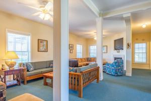 a living room with a couch and a table at Hatteras Hospitality 806 #101DS-H in Hatteras