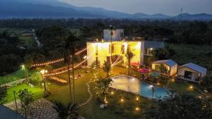an overhead view of a resort with a pool and lights at Hannah Villa Ba Vi - Venuestay in Ba Vì