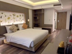 Arshika Bali Sunset Road tesisinde bir odada yatak veya yataklar