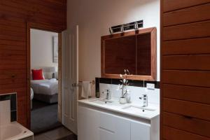 a bathroom with two sinks and a mirror at Halina Daylesford in Daylesford