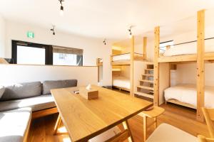 a living room with a couch and bunk beds at 強羅base B棟 - GORA base B in Gora
