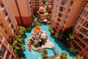 an aerial view of a water slide in a hotel pool at SEVEN SEAS CONDO RESORT in Jomtien Beach