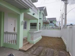 a house with green columns and a white fence at 3 bed 3 bath Friendly, Friendship area, Fibre bdb in Angeles