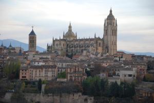 a view of a city with buildings and cathedral at Hotel Infanta Isabel by Recordis Hotels in Segovia