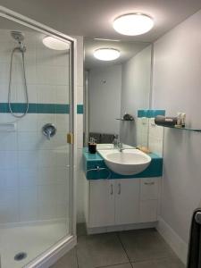 a bathroom with a sink and a shower at Alex Heads Beachfront Resort King Bed Studio Room in Alexandra Headland