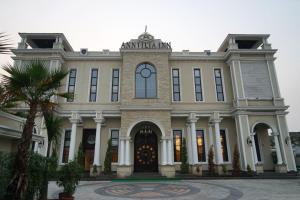 a large building with a clock on top of it at ANNTILIA INN in Ludhiana
