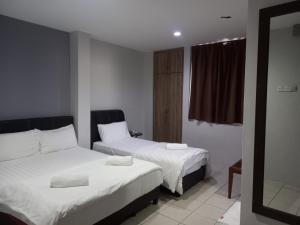 Postel nebo postele na pokoji v ubytování Reintree Lodge Hotel