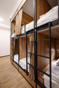 a group of bunk beds in a room at 281 Hostel in Bishkek