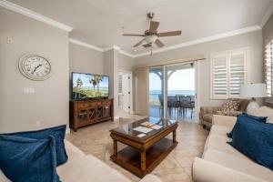 a living room with a couch and a table at 835 Cinnamon Beach, 3 Bedroom, Sleeps 8, Diamond Rated, Ocean Front, 2 Pools in Palm Coast