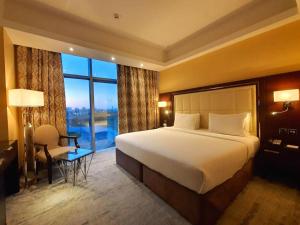 Postel nebo postele na pokoji v ubytování Copthorne Hotel Dubai