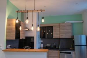 Kuchyňa alebo kuchynka v ubytovaní Appartement Quai Jean Jaurès Le Panorama