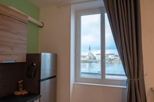 Kuchyňa alebo kuchynka v ubytovaní Appartement Quai Jean Jaurès Le Panorama