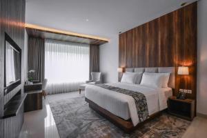 Ένα ή περισσότερα κρεβάτια σε δωμάτιο στο Forest Hills Hotel