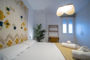 Postel nebo postele na pokoji v ubytování Apartamento La Habanera de Cadiz