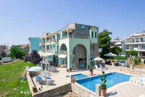 a villa with a swimming pool in a resort at Villa Anthelion in Limenaria