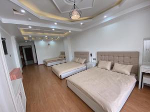 Ένα ή περισσότερα κρεβάτια σε δωμάτιο στο Thanh Anh Hotel Da Lat