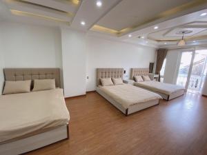Ένα ή περισσότερα κρεβάτια σε δωμάτιο στο Thanh Anh Hotel Da Lat