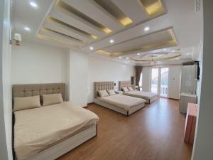 Ένα ή περισσότερα κρεβάτια σε δωμάτιο στο Thanh Anh Hotel Da Lat