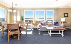 a living room with a couch and a table at Provincetown Inn in Provincetown