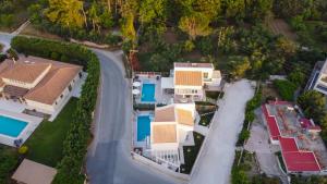 an overhead view of a house with a road and houses at Grande Mandi & Jani Villa in Laganas