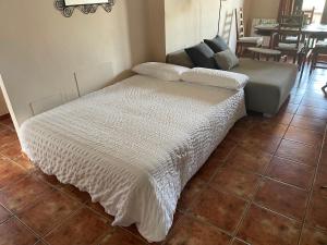 A bed or beds in a room at La casita del pueblo