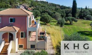 a villa with a view of a hill and trees at Villa Elaionas 1 Experiencing nature's tranquility! in Svoronata