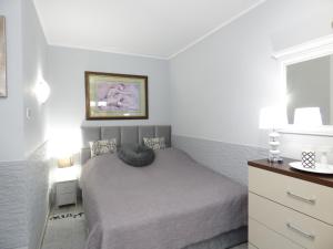 Posteľ alebo postele v izbe v ubytovaní Apartamenty Albatros ALB