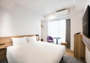 TV a/nebo společenská místnost v ubytování Tokyu Stay Shibuya Shin-Minamiguchi