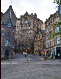 a street in front of a large brick building at The Inn Place in Edinburgh