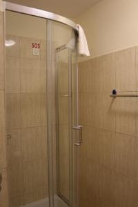 a shower with a glass door in a bathroom at Villa Varoš in Split
