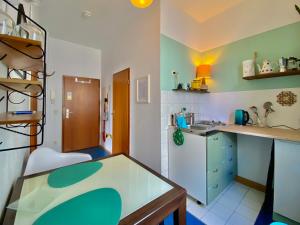 a kitchen with a sink and a counter top at Appartement Buntspecht in Erfurt