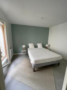 Posteľ alebo postele v izbe v ubytovaní Les appartements d’Edgar
