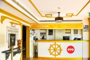 a restaurant with a steering wheel on the counter at OYO 137 Marina Hotel in Muscat