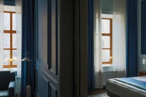 Postel nebo postele na pokoji v ubytování Leopolis Hotel