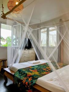 Postel nebo postele na pokoji v ubytování Gite Corossol Martinique + 13 fotografií